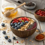 Perfect coconut bowl topped with vibrant fruits and superfoods like cacao nibs and goji berries