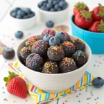 Bowl of colorful chocolate covered blueberries with sprinkles for a festive look